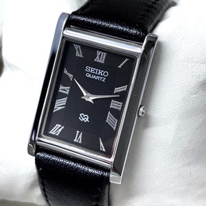 Reloj de pulsera Seiko Slim Tank negro de cuarzo para hombre, estilo vintage, reacondicionado, fabricado en Japón.