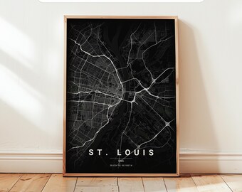 May include: A framed vertical wall art print featuring a black and white map of St. Louis, USA. The map displays white street grids against a black background with the text ST. LOUIS, USA, and coordinates 38.6244 N / -90.1900 W at the bottom.
