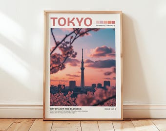 May include: A framed art print featuring a Tokyo cityscape at sunset. The image showcases the Tokyo Skytree and cherry blossoms. The word "TOKYO" is at the top, with the text "CITY OF LIGHT AND BLOSSOMS" below the image. The print is displayed on a wooden floor.