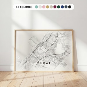 May include: A rectangular wall art print featuring a detailed black and white street map of Dubai, UAE. The map displays intricate road networks, coastal outlines, and the text DUBAI UAE with coordinates 25.0743 N / 55.1883 E centered at the bottom.
