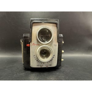 May include: A rustic wooden sign with the text "Welcome to our home" in white lettering. The sign has a distressed finish and a simple, inviting design, ideal for entryway decor.