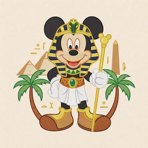May include: An embroidered design featuring a cartoon mouse dressed as an Egyptian pharaoh, wearing a gold and blue striped headdress with a cobra, a white kilt, and gold boots. The mouse holds a gold staff, flanked by palm trees and pyramids.