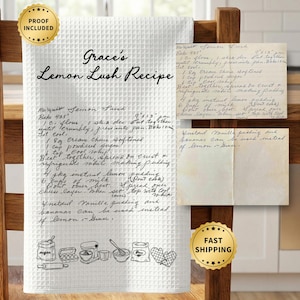 May include: White waffle-weave kitchen towel with a handwritten recipe for "Grace's Lemon Lush Recipe." The towel has a black line drawing of kitchen tools along the bottom. Includes a "Proof Included" and "Fast Shipping" seal.