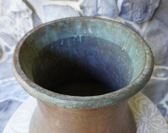 An original antique copper bucket, acquired and produced in Egypt well over a century ago.