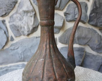 An antique hand hammered copper pitcher obtained in Egypt