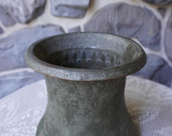 Very old rustically engraved bucket.