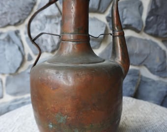 An elegant antique handmade copper ewer acquired in Egypt