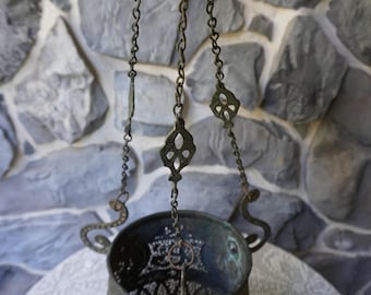 An antique ceiling hanging copper Incense Holder