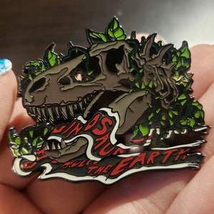 Jurassic "When Dinosaurs Walked The Earth" T-Rex Skull Enamel Pin