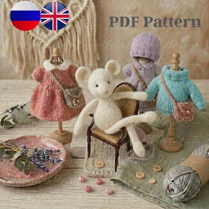 May include: A collection of knitted items, including a mouse toy, dresses, and sweaters, displayed on wooden stands. The items are in pastel colors, with small purses. The image also includes a small chair, yarn, and the text "PDF Pattern".