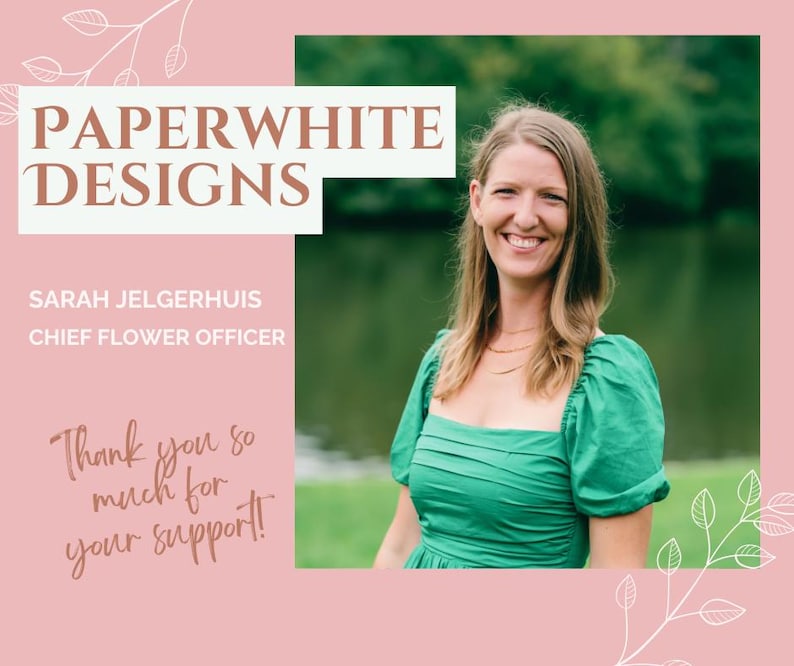 May include: A woman with long brown hair smiles at the camera. She is wearing a green dress and a gold necklace. The background is a blurred image of a lake and trees. The text "PAPERWHITE DESIGNS" is in a white box with a brown outline. The text "SARAH JELGERHUIS CHIEF FLOWER OFFICER" is in brown text. The text "Thank you so much for your support!" is in brown cursive text.