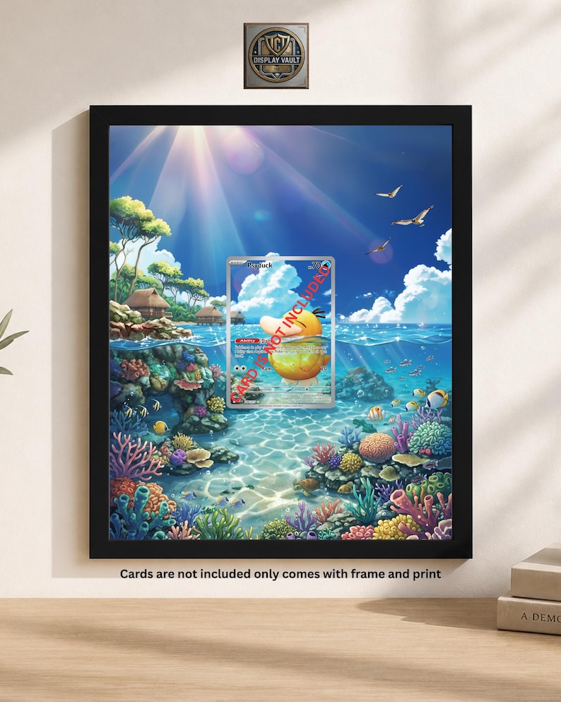 May include: Framed artwork featuring a vibrant underwater scene with a Psyduck trading card. The artwork showcases colorful coral reefs, fish, and a sunny sky. The frame is black, and the text "Cards are not included only comes with frame and print" is visible.