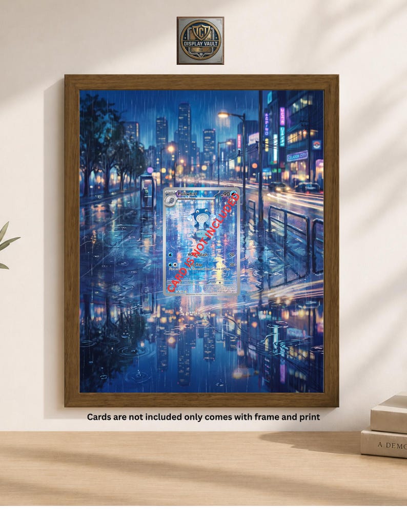 May include: A framed print of a rainy city street scene at night, with reflections in the wet pavement. The artwork features a trading card with a cartoon character. The frame is brown, and the print is displayed on a white wall.