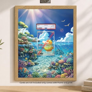 May include: A framed print featuring a vibrant underwater scene with colorful coral reefs, fish, and a sunny sky. A graded trading card is displayed in front of the print. The text "Cards are not included only comes with frame and print" is visible.