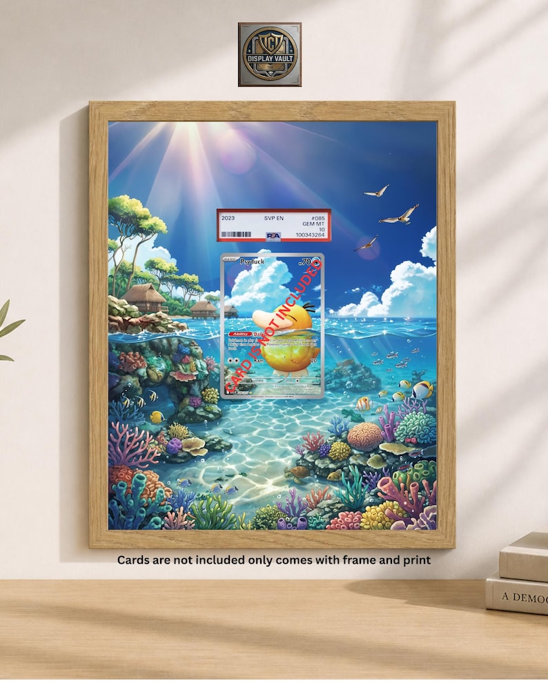 May include: A framed print featuring a vibrant underwater scene with colorful coral reefs, fish, and a sunny sky. A graded trading card is displayed in front of the print. The text "Cards are not included only comes with frame and print" is visible.
