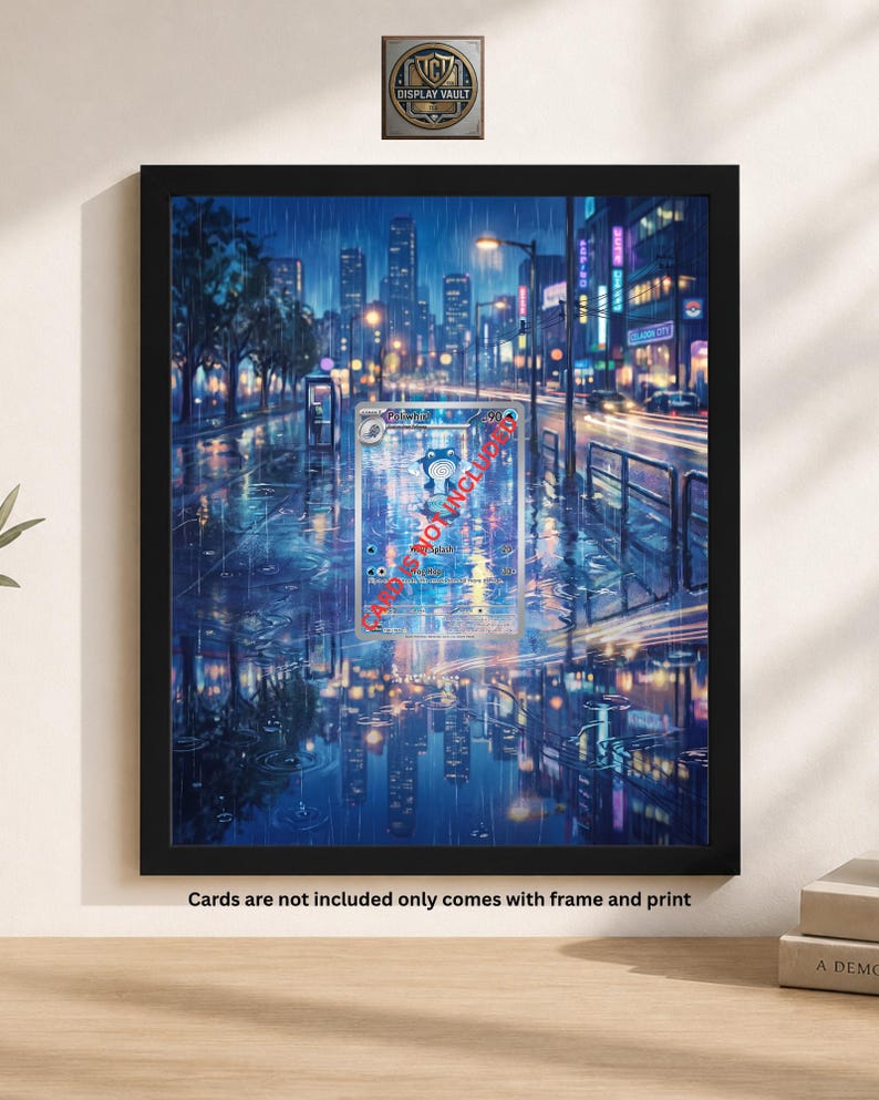 May include: Framed print of a rainy city street scene at night, with reflections in the wet pavement. The artwork features a trading card in the center. The frame is black. The text at the bottom says "Cards are not included only comes with frame and print."