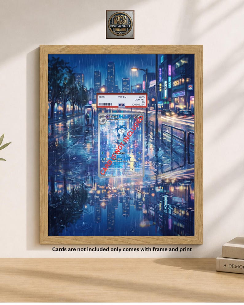 May include: A framed print featuring a vibrant, rainy cityscape with reflections on the wet pavement. The artwork includes a trading card with text and a display vault logo. The frame is made of light-colored wood. The text on the print says "Cards are not included only comes with frame and print."