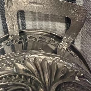 Vintage Guernsey Ware casserole dish with ornate silver-plated serving stand