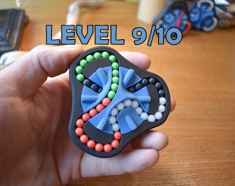O Delta (4 Cores) | Quebra-cabeça de Contas Giratórias | Desafio 3D Ultra Difícil | Quebra-cabeça Mecânico Inquieto | Para maiores de 14 anos