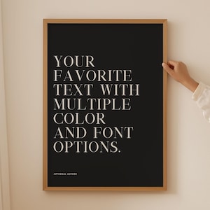 May include: A rectangular framed wall art piece featuring a black background with white serif text that reads: YOUR FAVORITE TEXT WITH MULTIPLE COLOR AND FONT OPTIONS. Below the main text, smaller white text reads: OPTIONAL AUTHOR.