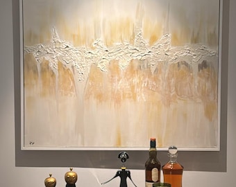May include: An abstract painting with a white frame hangs above a dark wood cabinet. The painting features textured white and yellow brushstrokes. On the cabinet are salt and pepper shakers, a wine opener, bottles, and glasses, suggesting a bar or dining area.