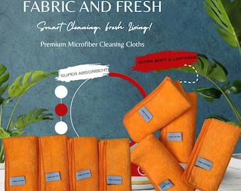 Op de afbeelding: Oranje microvezel schoonmaakdoeken met de tekst "Fabric and Fresh" op een blauw label. De afbeelding bevat de tekst "Fabric and Fresh, Smart Cleaning, fresh Living!" en "Premium Microfiber Cleaning Cloths". De doeken zijn gelabeld als "Super Absorbent" en "Ultra Soft & Lint-Free".