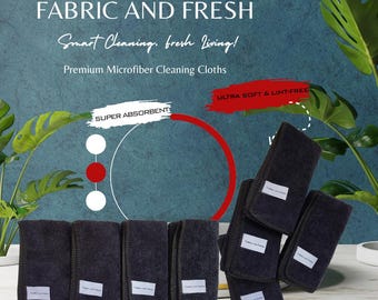 Op de afbeelding: Een verzameling donkergrijze microvezel schoonmaakdoeken met witte labels. De afbeelding bevat de tekst "FABRIC AND FRESH" en "Smart Cleaning, fresh Living!". De doeken worden beschreven als "SUPER ABSORBENT" en "ULTRA SOFT & LINT-FREE".