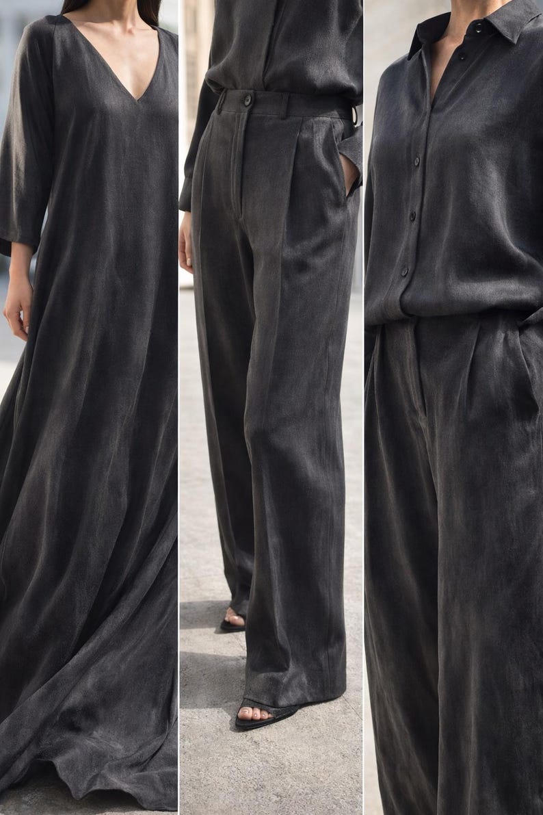 K&ouml;nnte beinhalten: Ein dunkelgraues Ensemble mit einem flie&szlig;enden V-Ausschnitt-Kleid, einer hoch taillierten Hose mit Falten und einem Hemd mit Kn&ouml;pfen. Die Kleidung scheint aus einem weichen, flie&szlig;enden Stoff zu bestehen, der f&uuml;r eine minimalistische Garderobe geeignet ist.