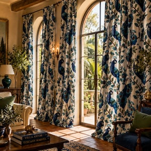 May include: Elegant, floor-length curtains with a peacock feather design in shades of blue and green. The curtains frame arched windows, creating a luxurious and inviting interior. The room features a sofa, armchair, and decorative vases.