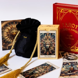 May include: A tarot card set featuring a red book with gold lettering, a black velvet bag with gold tassels, and a deck of cards. The card box displays "The World" card. Several tarot cards are scattered around the set.