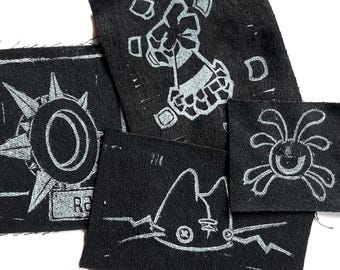Toppe stampate a mano con tecnica linoleografia, ispirate alla marmellata di animali.