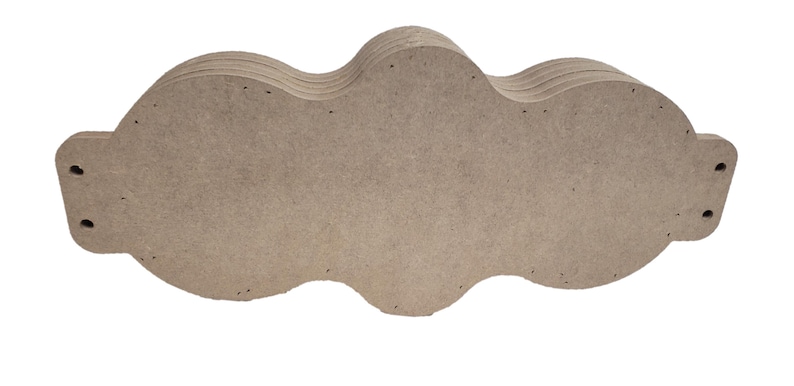 May include: A stack of unfinished, cloud-shaped wooden cutouts. The cutouts are a light brown color and have a smooth surface. Each cloud has a wavy design and pre-drilled holes for hanging or assembly. Ideal for DIY projects.