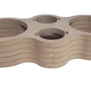 May include: A stack of unfinished MDF wood speaker enclosures. The enclosures have a light brown color and a layered design with circular and oval cutouts. The design includes mounting tabs on the sides.