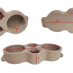 May include: A layered, unfinished wood organizer with three circular openings and a smaller central opening. The overall dimensions are 20 inches wide, 8.75 inches high, and 3 inches deep. The openings are 3 inches in diameter.