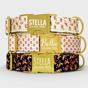 May include: Three personalized dog collars with gold-colored buckles. The top collar has a white background with orange tiger illustrations. The middle collar has a white background with orange tiger faces. The bottom collar has a navy background with orange tiger illustrations. Each collar has a name and phone number.