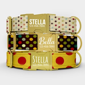 May include: Three dog collars with gold-colored buckles and patterned fabric. One collar has a beige background with colorful polka dots, another has a dark brown background with polka dots, and the third has a yellow background with red polka dots. Each collar has a name and phone number.