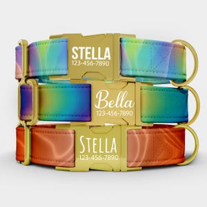 May include: Three dog collars stacked on top of each other. The top collar is a rainbow gradient with the name "Stella" and a phone number printed in white. The middle collar is a rainbow gradient with the name "Bella" and a phone number. The bottom collar is orange and red with the name "Stella" and a phone number.