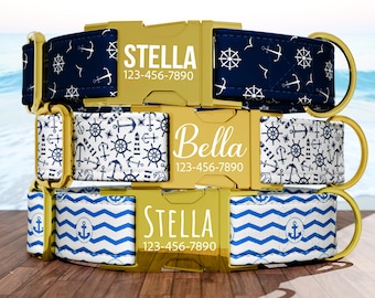 May include: Three personalized dog collars with gold buckles. The top collar is navy blue with white anchors and the name "Stella". The middle collar is white with navy blue nautical designs and the name "Bella". The bottom collar is blue and white with the name "Stella".