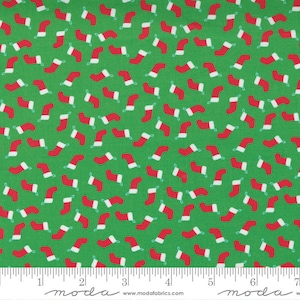 May include: Green fabric with a repeating pattern of red and white Christmas stockings. The fabric is 44 inches wide.