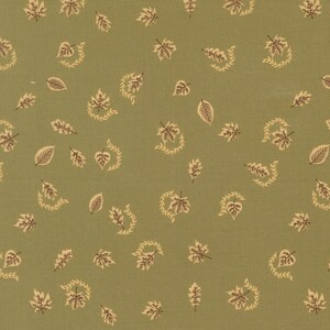 May include: A sage green fabric featuring a repeating pattern of small, dark brown leaves and delicate, curved vine-like sprigs scattered across the surface. The textile has a visible woven texture with a consistent, evenly spaced botanical print.
