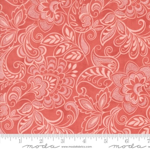 May include: Coral fabric with a repeating floral pattern. The design features large, stylized flowers, leaves, and swirling paisley elements in a lighter coral color. The fabric has a textured appearance and is suitable for various sewing projects.