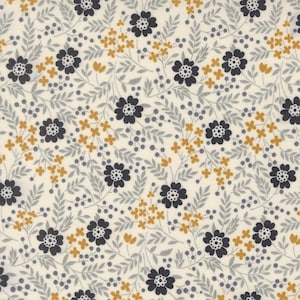 May include: Cream-colored fabric with a repeating floral pattern. The design features dark blue flowers with white centers, small yellow flowers, gray leaves, and tiny gray berries. The overall aesthetic is delicate and botanical.