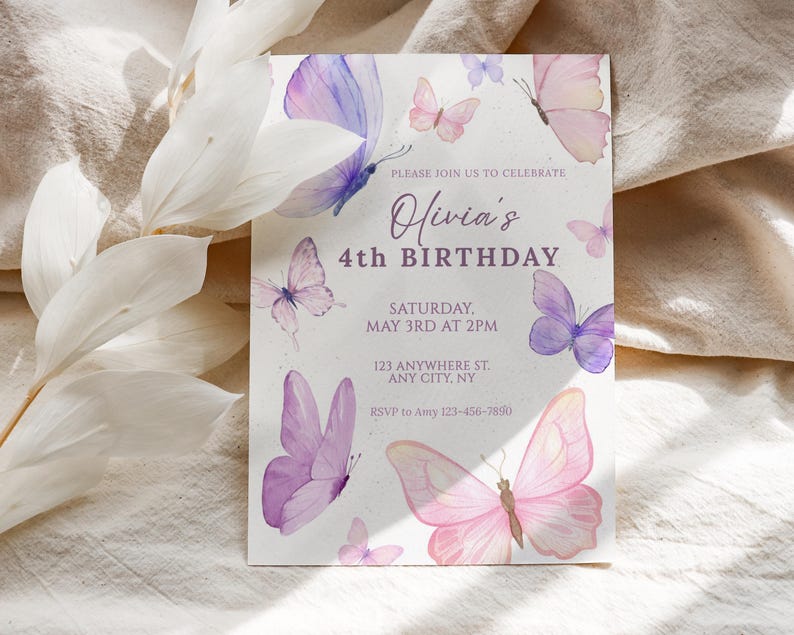 May include: A birthday invitation featuring watercolor butterflies in shades of pink and purple. The text reads "Olivia's 4th Birthday" with event details. The design includes delicate butterfly illustrations scattered around the edges.