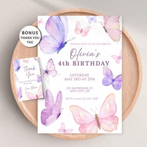 May include: A birthday invitation and thank you tag set. The invitation features watercolor butterflies in shades of pink and purple, with the text "Olivia's 4th Birthday". The thank you tag has matching butterfly graphics.