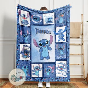 May include: Blue fleece blanket featuring various images of the character Stitch from Lilo & Stitch. The blanket has a central image of Stitch with the name "Name" above it. Other images include the phrases "Oh Yeah Whatever", "Hello", and "Stay Weird".