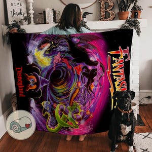 May include: A black blanket with a vibrant fantasy-themed design featuring a swirling vortex of purple, pink, and blue. The blanket includes images of a dragon, Mickey Mouse, and the word "FANTASY" in orange.