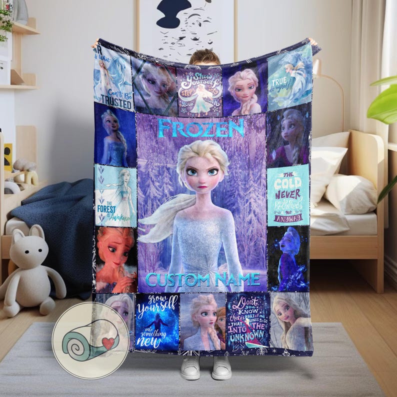 May include: A large, rectangular Frozen-themed blanket featuring Elsa. The blanket has a purple and blue color scheme with images of Elsa and text that reads "Frozen", "Custom Name", and other phrases. The blanket is displayed in a bedroom setting.