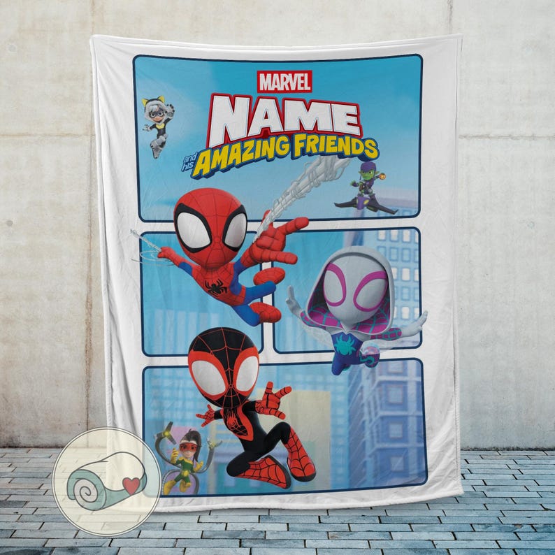 May include: White Marvel "Name and His Amazing Friends" blanket featuring cartoon Spider-Man, Spider-Gwen, and Miles Morales. The blanket has a blue background with cityscapes and other characters.