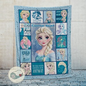 May include: A light blue fleece blanket featuring Elsa from Frozen. The blanket has a central image of Elsa surrounded by smaller images and quotes from the movie. The words "CUSTOM NAME" are also visible.