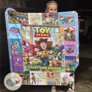 May include: A vibrant Toy Story blanket showcasing characters from the film. The blanket features Woody, Buzz Lightyear, and others, with "TOY STORY" and "CUSTOM NAME". Panels display phrases such as "INFINITY and BEYOND" and "You've got a friend in me". The design includes various cartoon images.